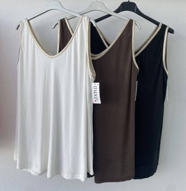Camiseta oversize filo dorado